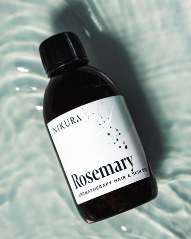 Rosemary oil for hair 250ml with a blue watery background