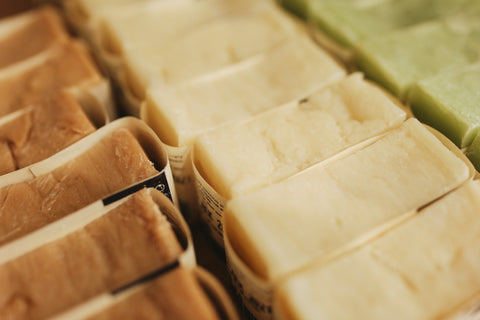 Three rows of soap bars, one brown, one cream, one green.