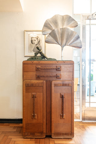 Art deco details fill the hotel like this cabinet and lamp in the lobby