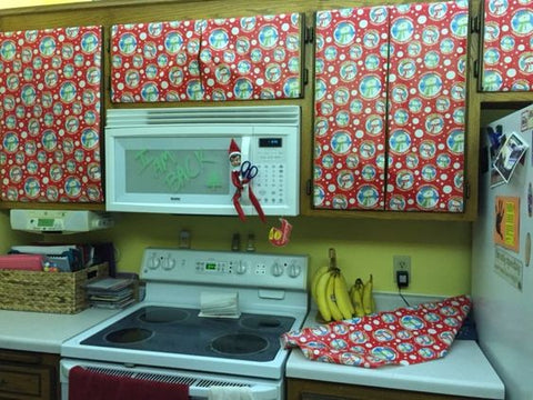 Elf on The Shelf Decorates Kitchen with Wrapping Paper