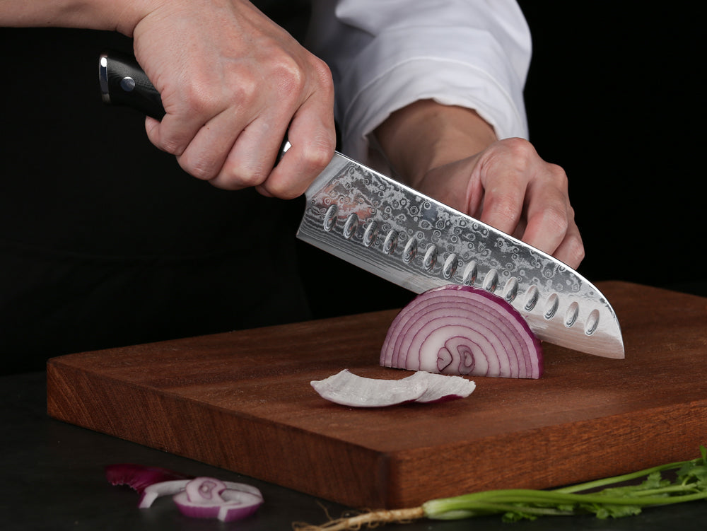 Having a great carving knife in your hand not only ensures you have an easy time slicing the Thanksgiving turkey, but it can also be used year round to carve roasts, pates and so much more. The line between carving knives and slicing knives blurred long since, but traditionally, a carving knife has a pointed tip while a slicing knife has a rounded tip.  In this article we take a look at the two different styles and see why both work just as well when carving or slicing meat. We also review some of the best carving knives around to help you choose the right carving knife for your next Thanksgiving dinner!