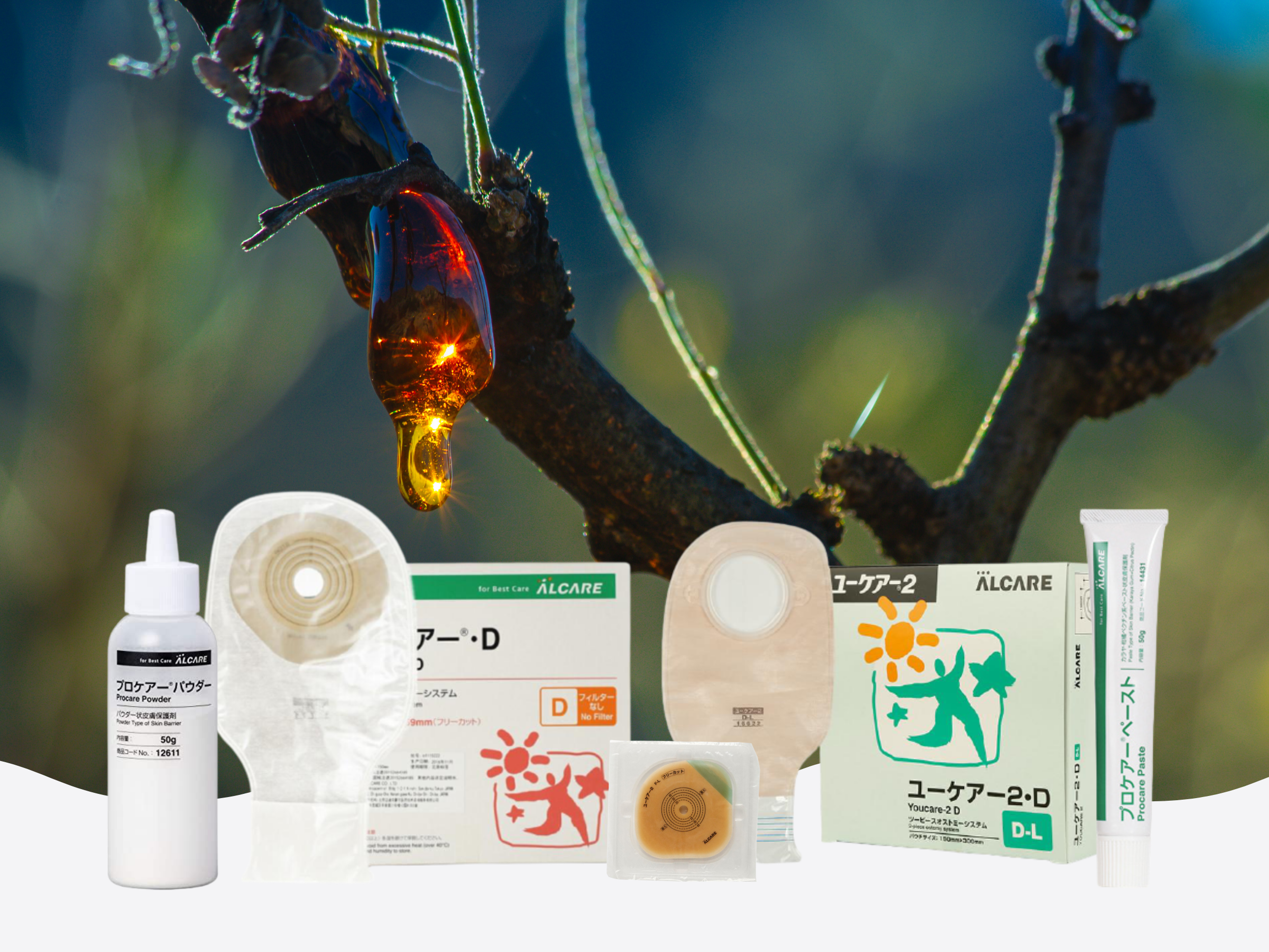 ALCARE ostomy & stoma care products. From left: procare powder, youcare d stoma bag, youcare 2f faceplate, youcare 2d stoma bag, procare paste. In the background - Karaya gum dripping off a karaya tree.