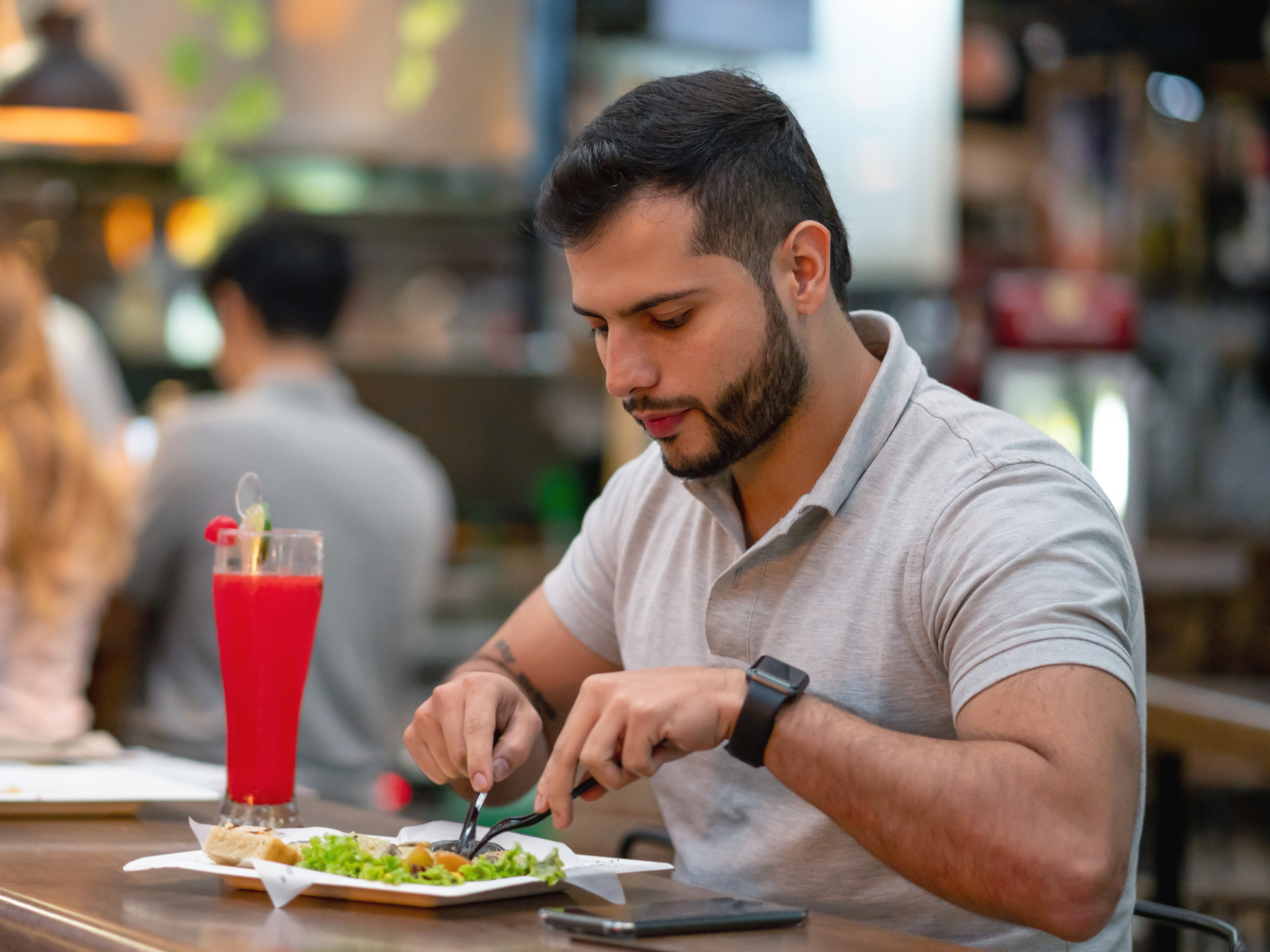 Man enjoying his meal alone in a restaurant