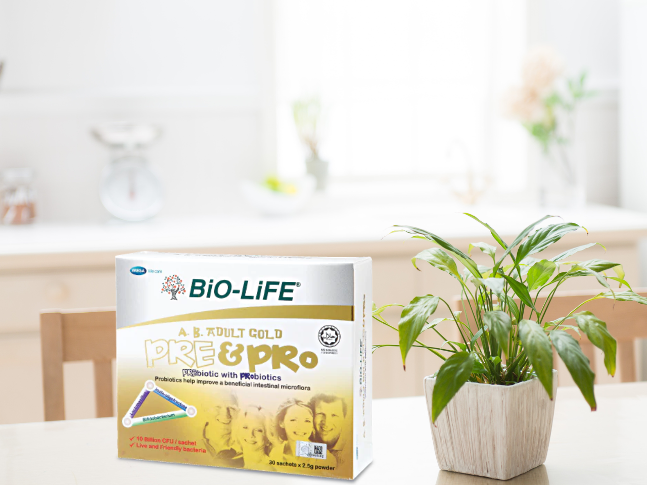 Bio-Life A.B. Adult Gold Pre & Probiotics displayed on a dining table beside a plant