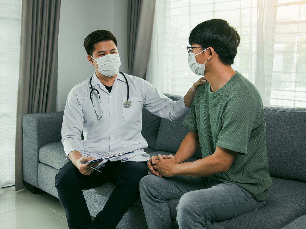 Doctor consulting male patient