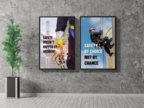 2 framed fall safety posters on a grey wall.