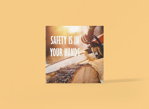 A chainsaw safety poster with a man chopping a log with a chainsaw.