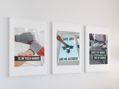 A trio of hand safety posters on a wall.