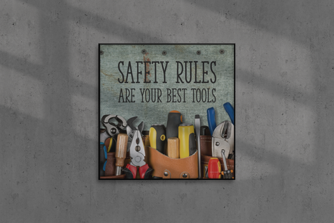 A safety poster showing various tools including screwdrivers, pliers, and wrenches laying on a worktable with the slogan safety rules are your best tools.