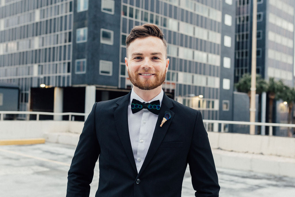 men in black suit and bow tie