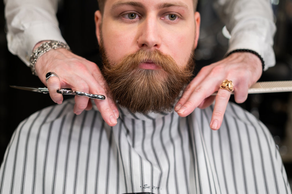 Mandujour model getting beard trimmed at barbershop Photo by cottonbro from Pexels