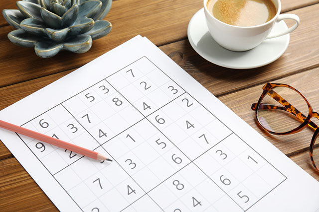 sudoku puzzle pencil coffee