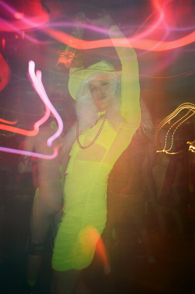 bushwig festival-goer in costume with neon lights.