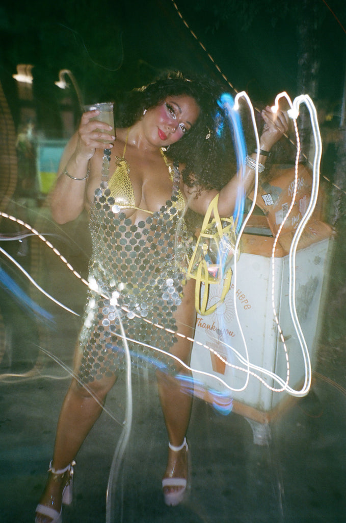 attendee in sparkling circular mirrored dress.