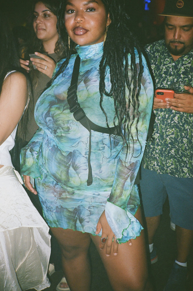 attendee in floral dress.