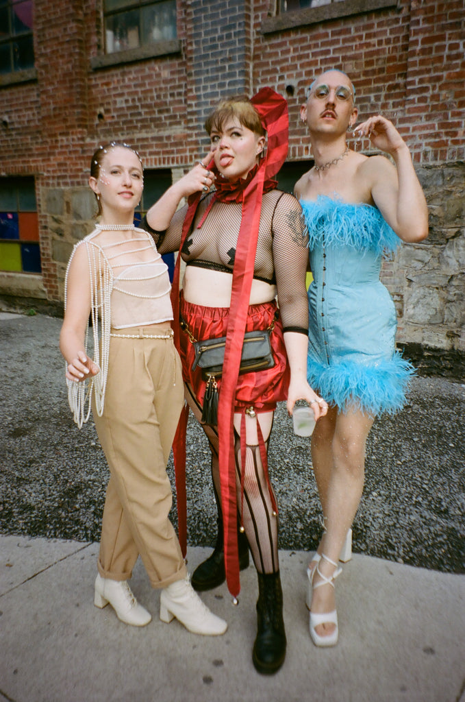 three patrons posing together.