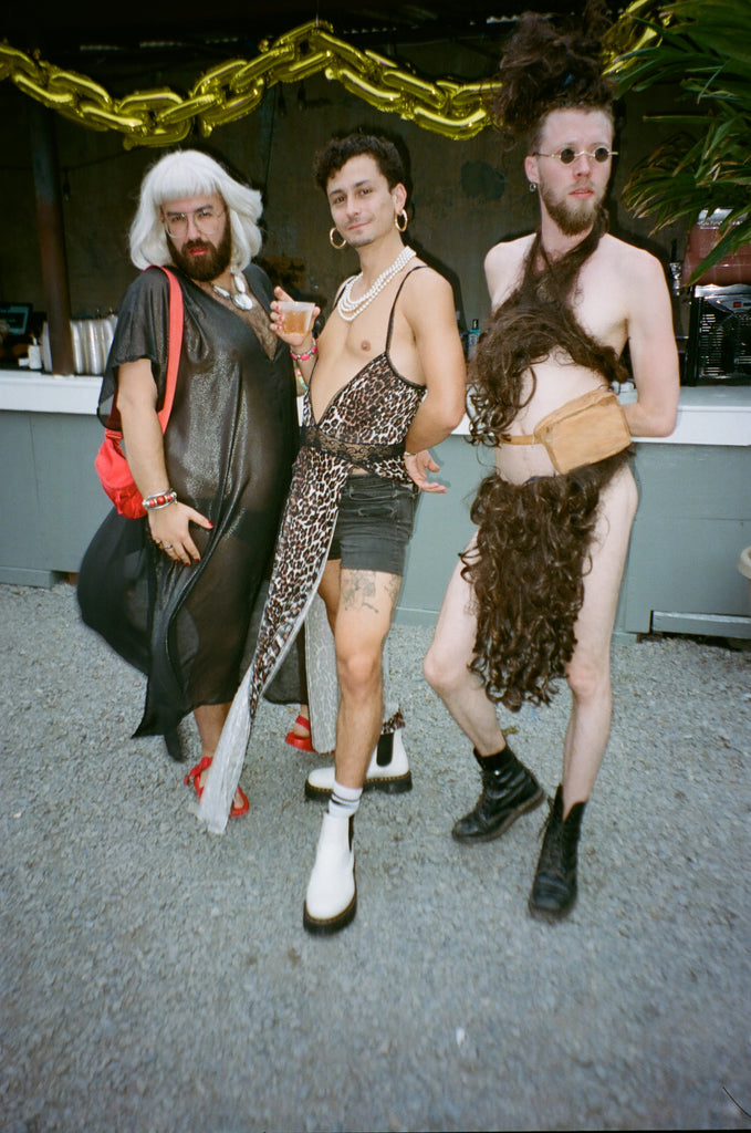 three friends posing.