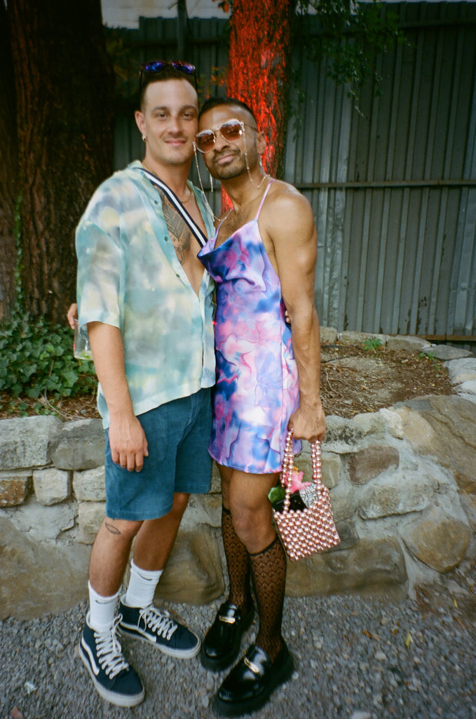 couple posing outside.