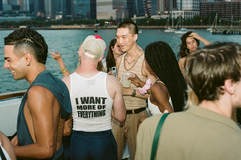 bushwick employees dancing outside the boat - text 'i want more of everything' highlighted.