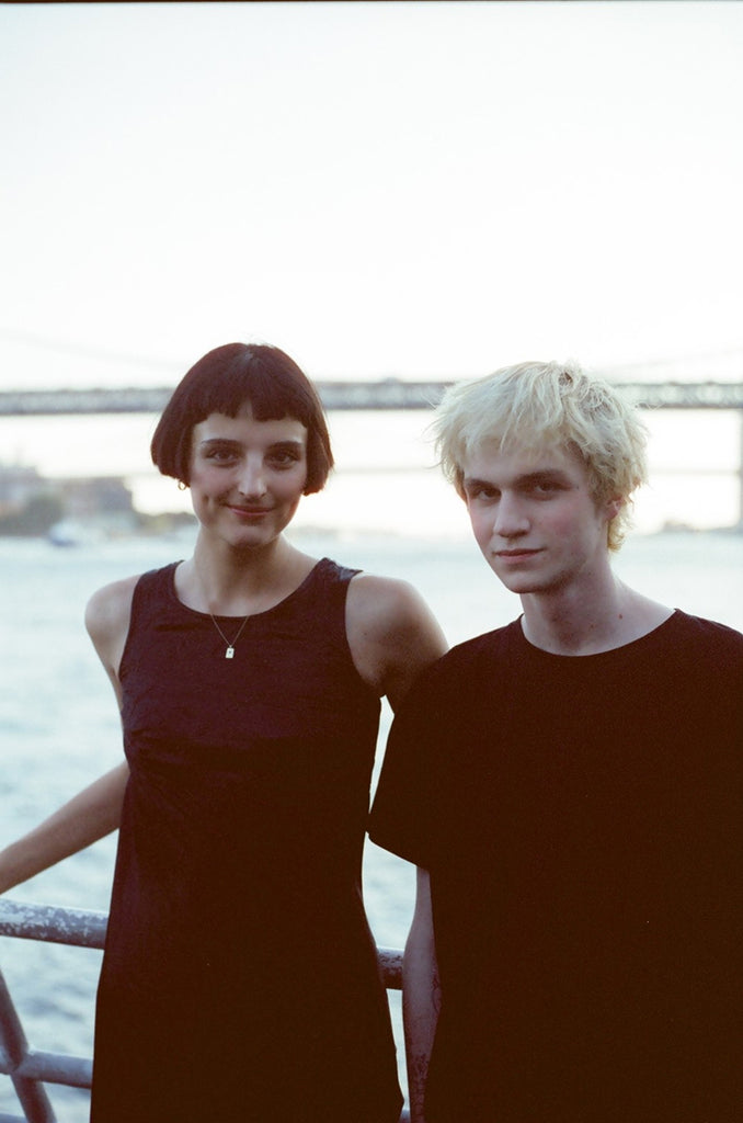 employee and date in all black on the bow of the boat 