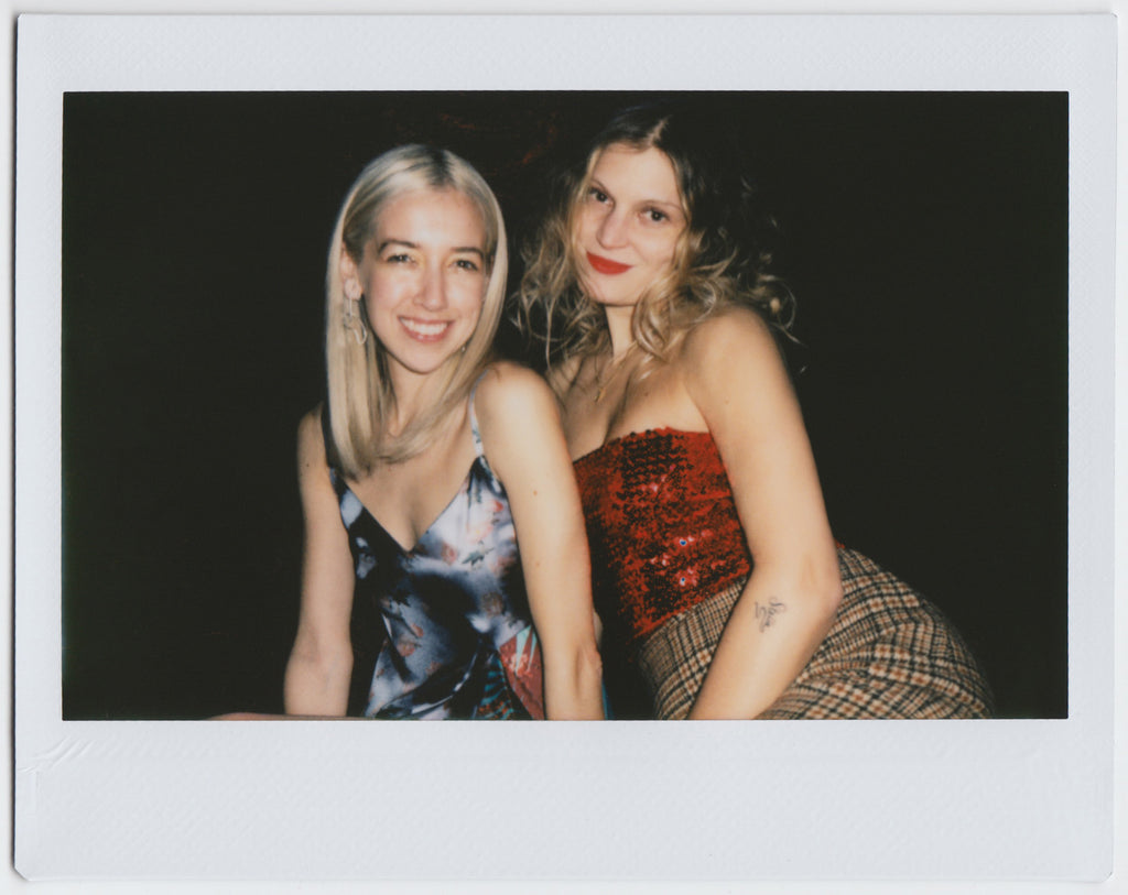 two people side by side smiling - polaroid style. 