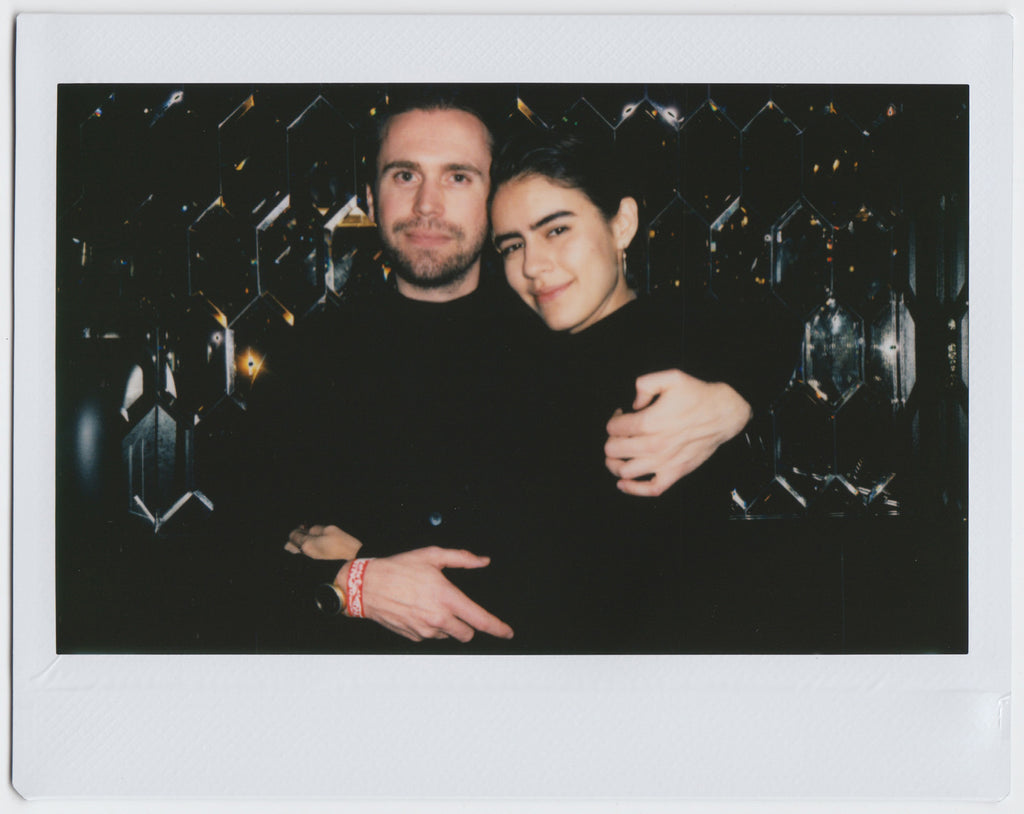 duo hugging with gentle smiles - polaroid style.