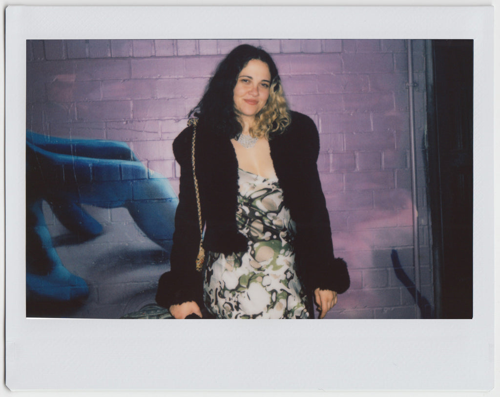 person posing, smiling to the camera - polaroid style.