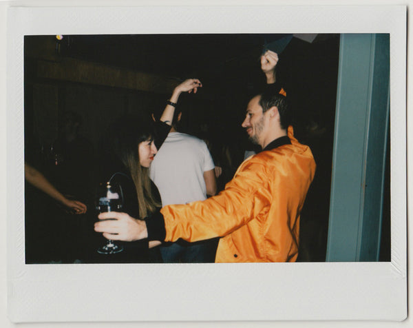 employees dancing in the dance floor - polaroid style.