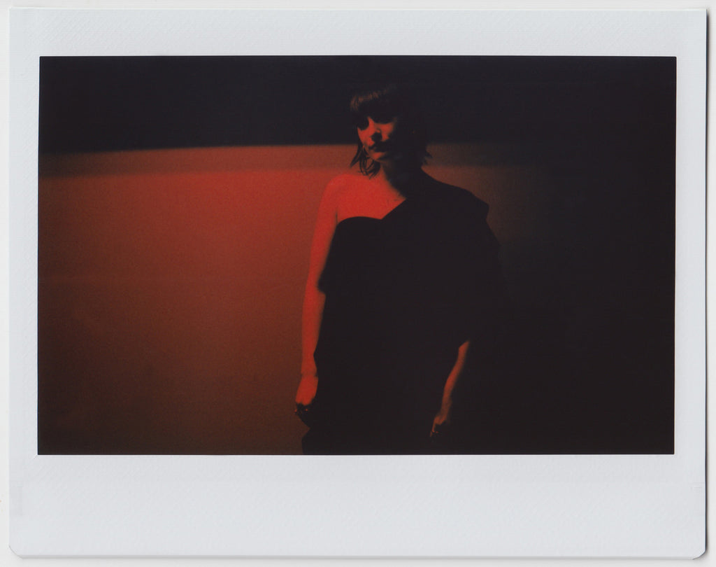 person posing, silhouette in all red effect - polaroid style. 