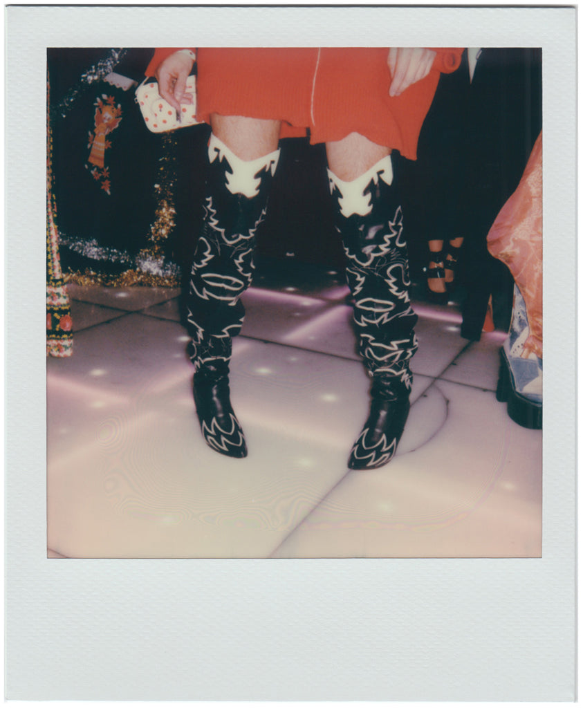 b&w cowboy boots on the dance floor - polaroid style.