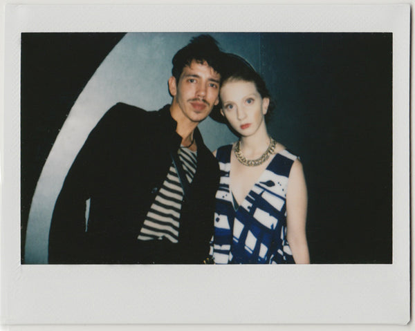 two people posing to the camera - polaroid style.