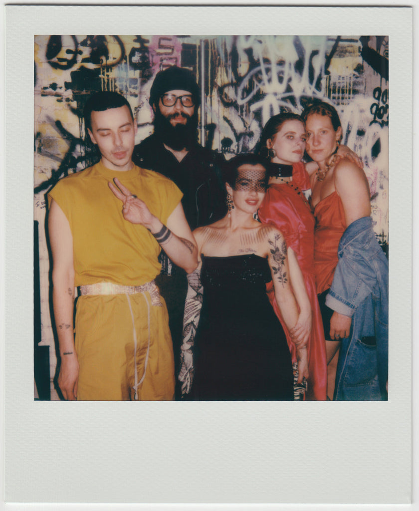 group of people, posing at camera - polaroid style.