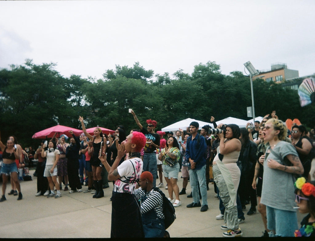 attendees cheering on performer at transmission 