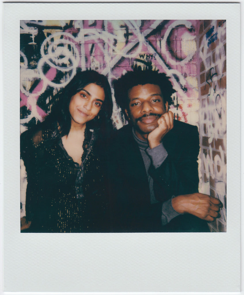 two people, nicely smiling at camera - polaroid style.