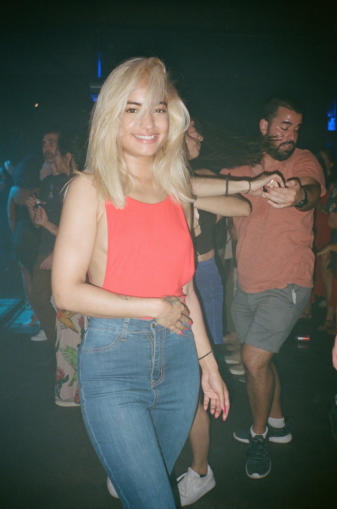 attendee smiling on the dance floor.