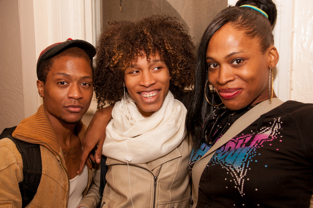 portrait of three people posing.