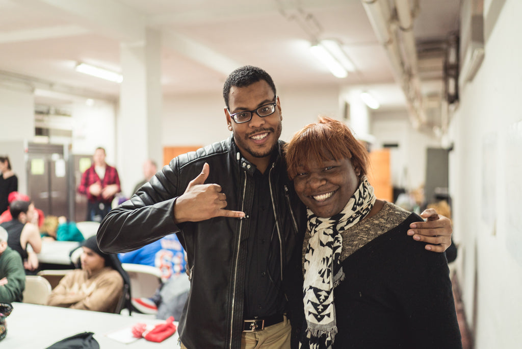 two people posing at event.