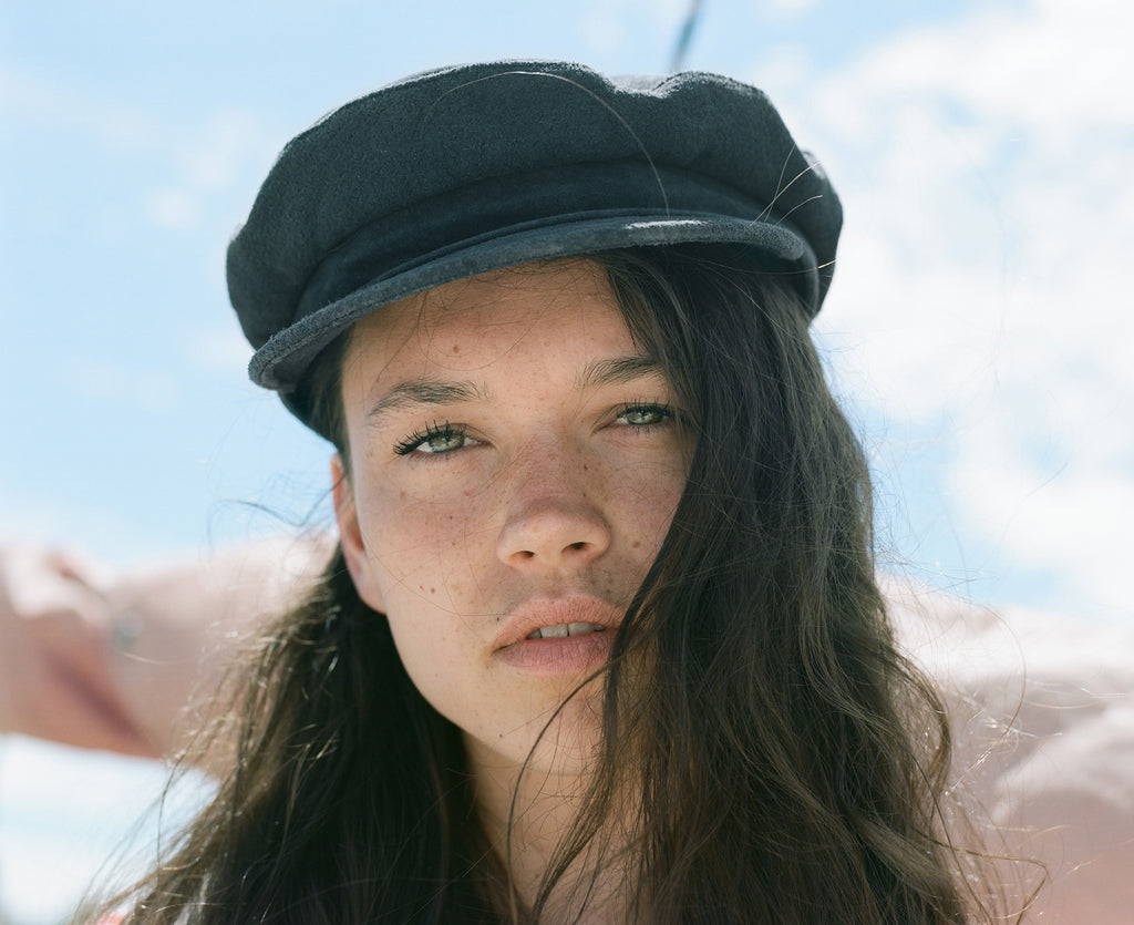 stunning portrait of model in sailers cap.