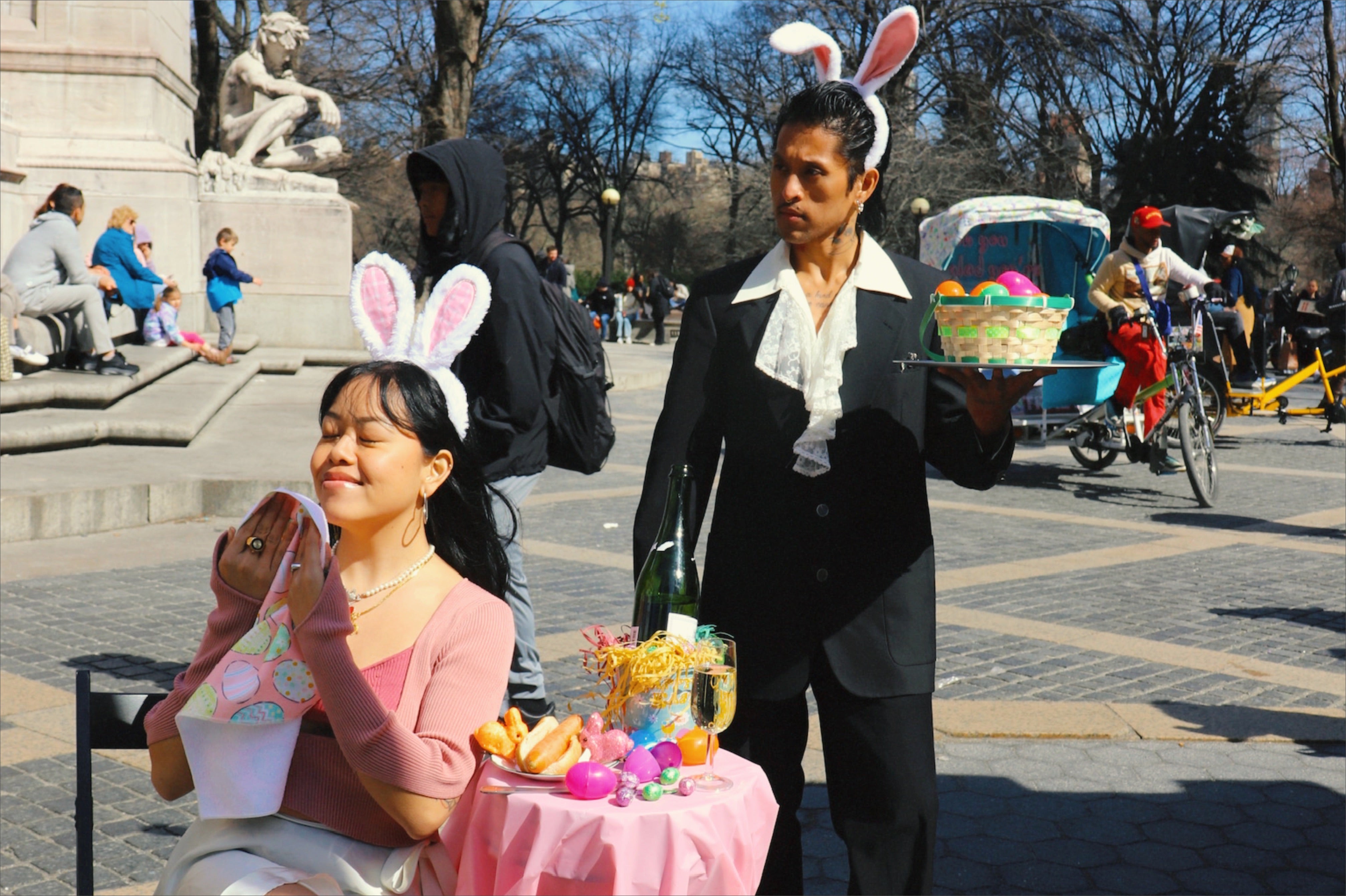 comical editorial shot of easter bunny dinner in central park