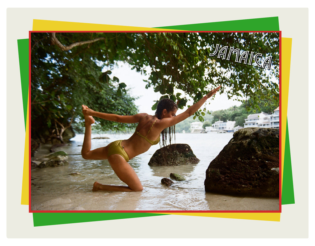 a person in a bikini doing yoga in the water.