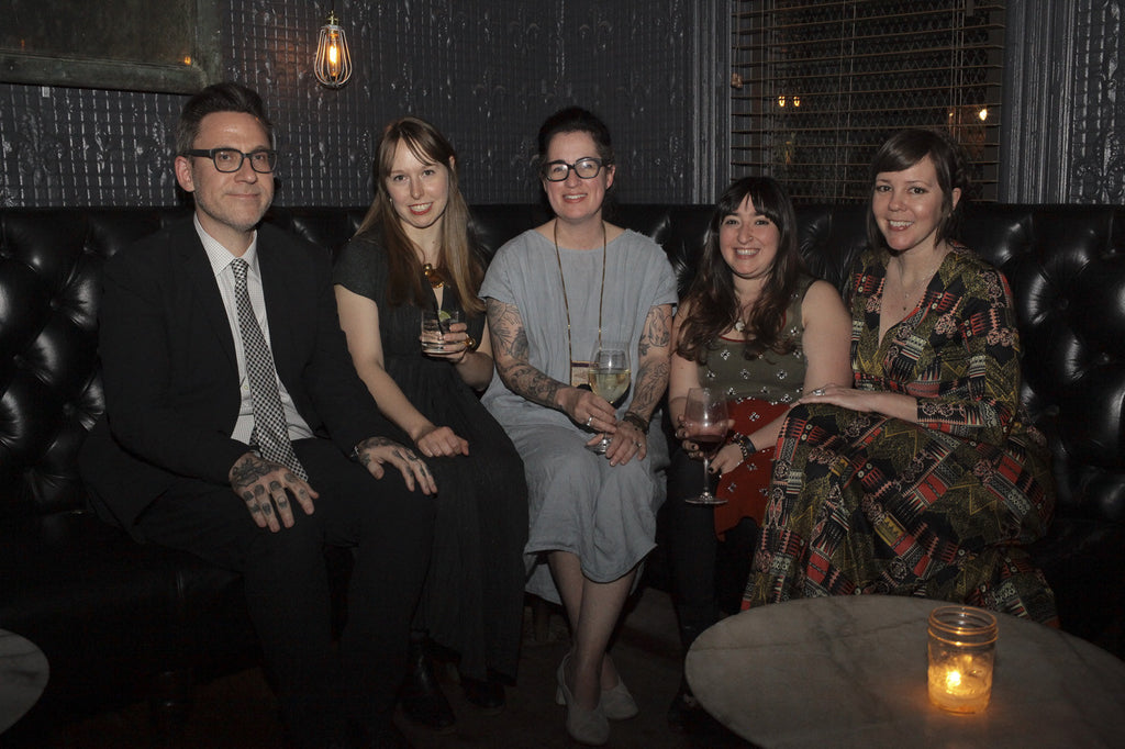 park slope team sitting and posing, smiling.