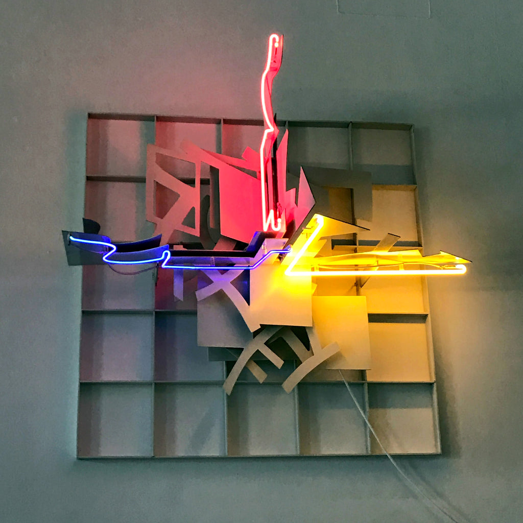 a neon light sculpture on a wall.