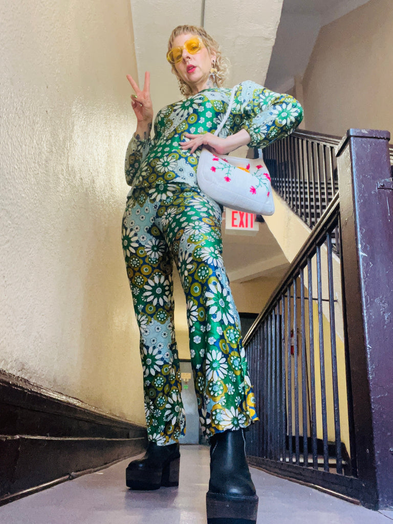 blaire ludwig posing in hallway in vintage two piece and bag