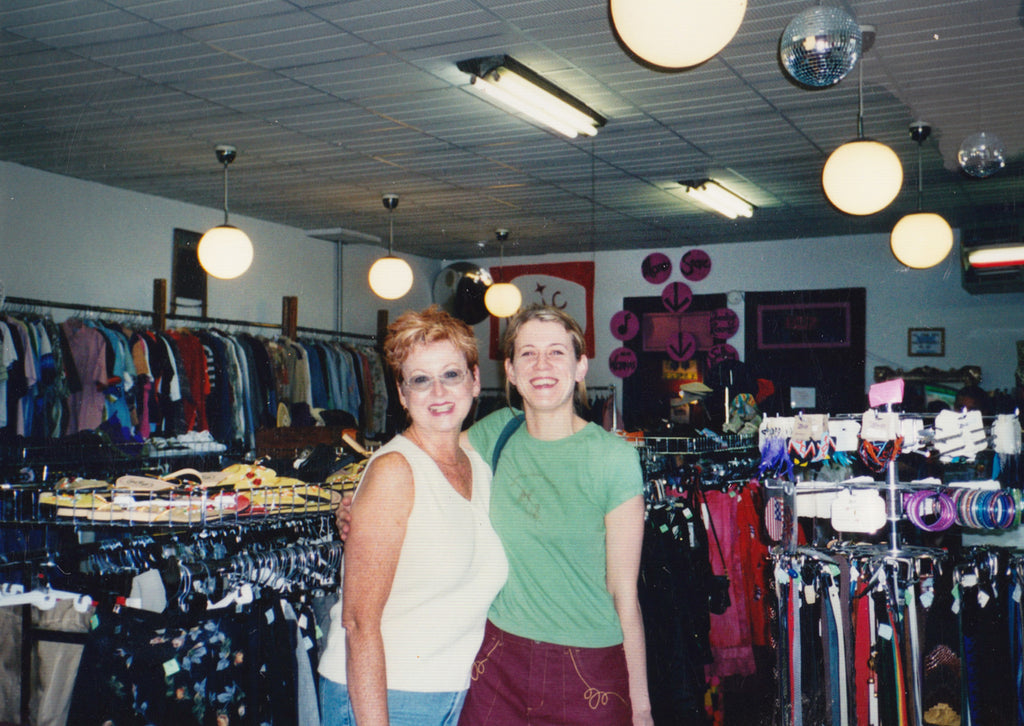happy shoppers c1998, two women smiling among racks