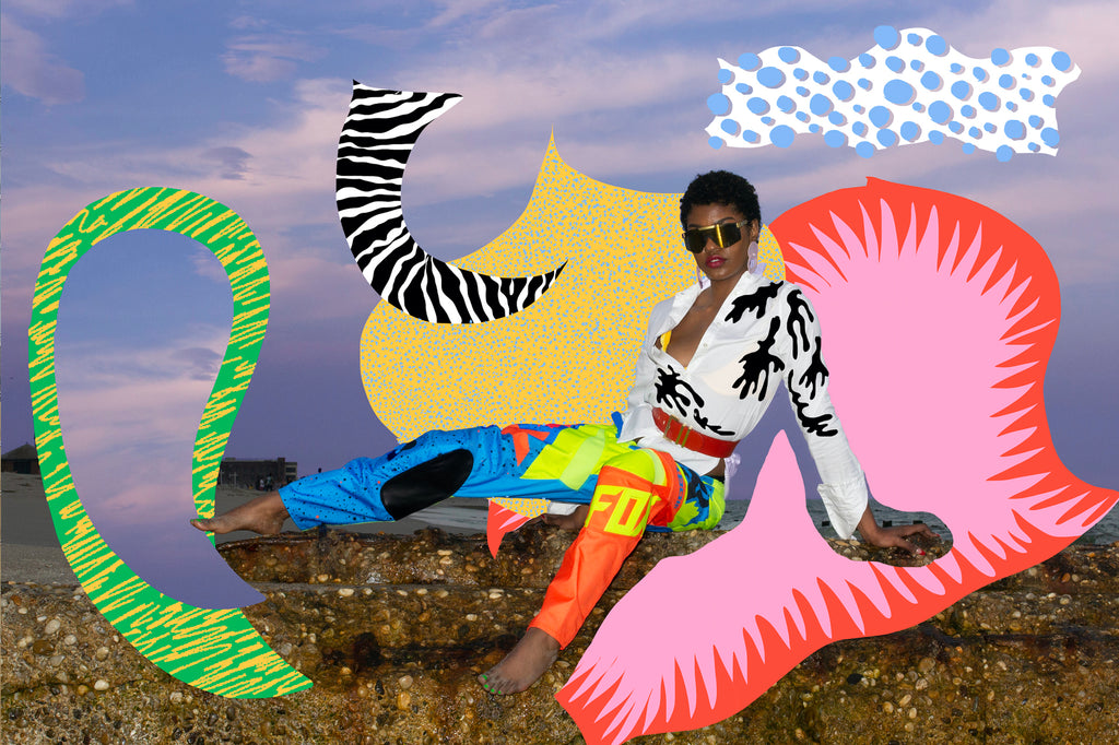 model in race pants and button up shirt on rocks at the beach with collage art added in post by dana.