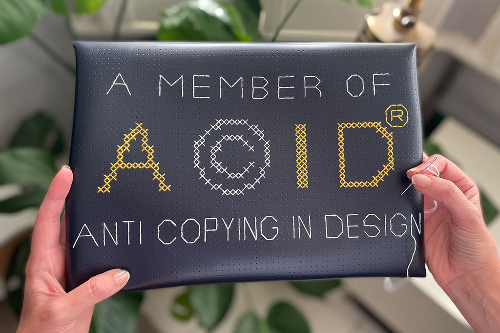 Stitched laptop sleeve with Anti Copying in Design ACID logo