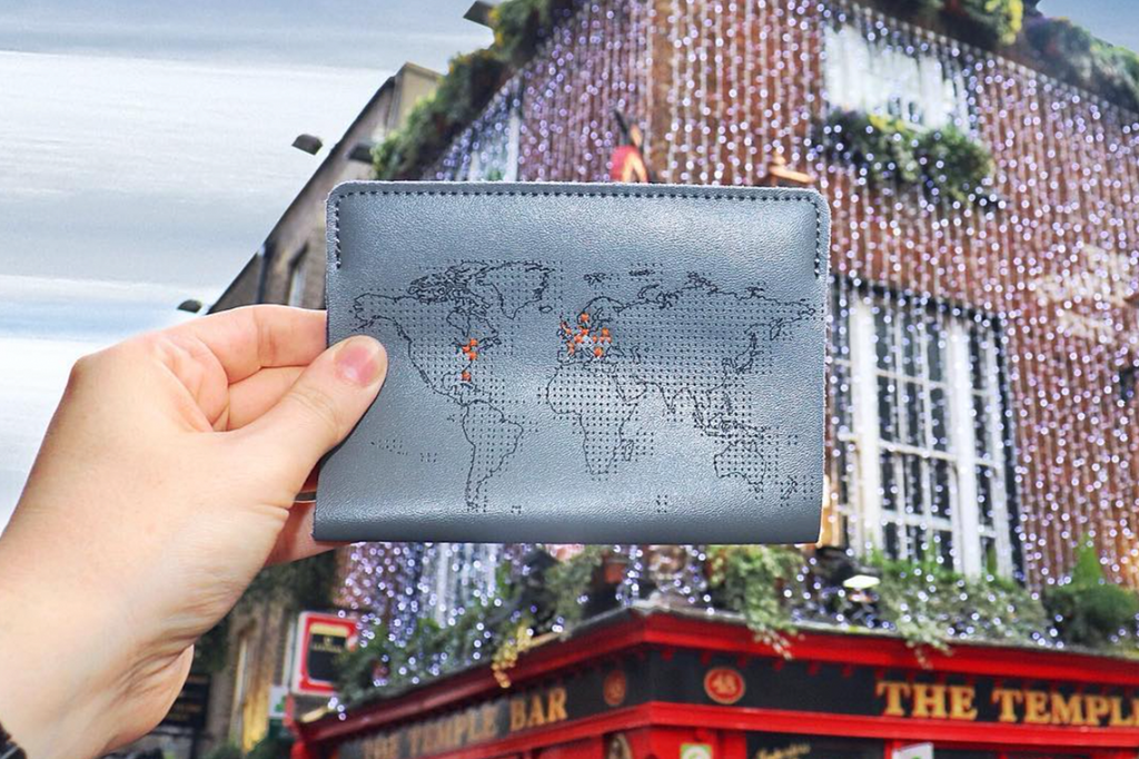 Stitch where you've been map passport cover in grey leather with orange thread 