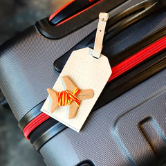 Light Grey Stitch Luggage Tag on suitcase