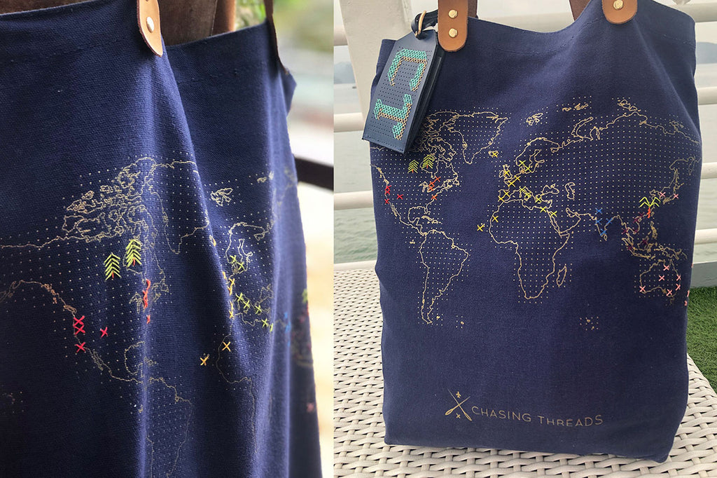 Stitch navy tote bag with icons and crosses sewn