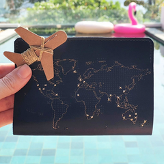 navy stitch passport cover with gold threads at pool Thailand